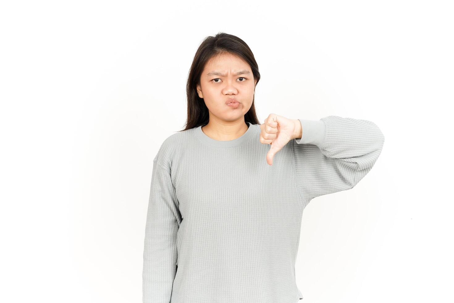 A woman is showing a thumbs down sign photo