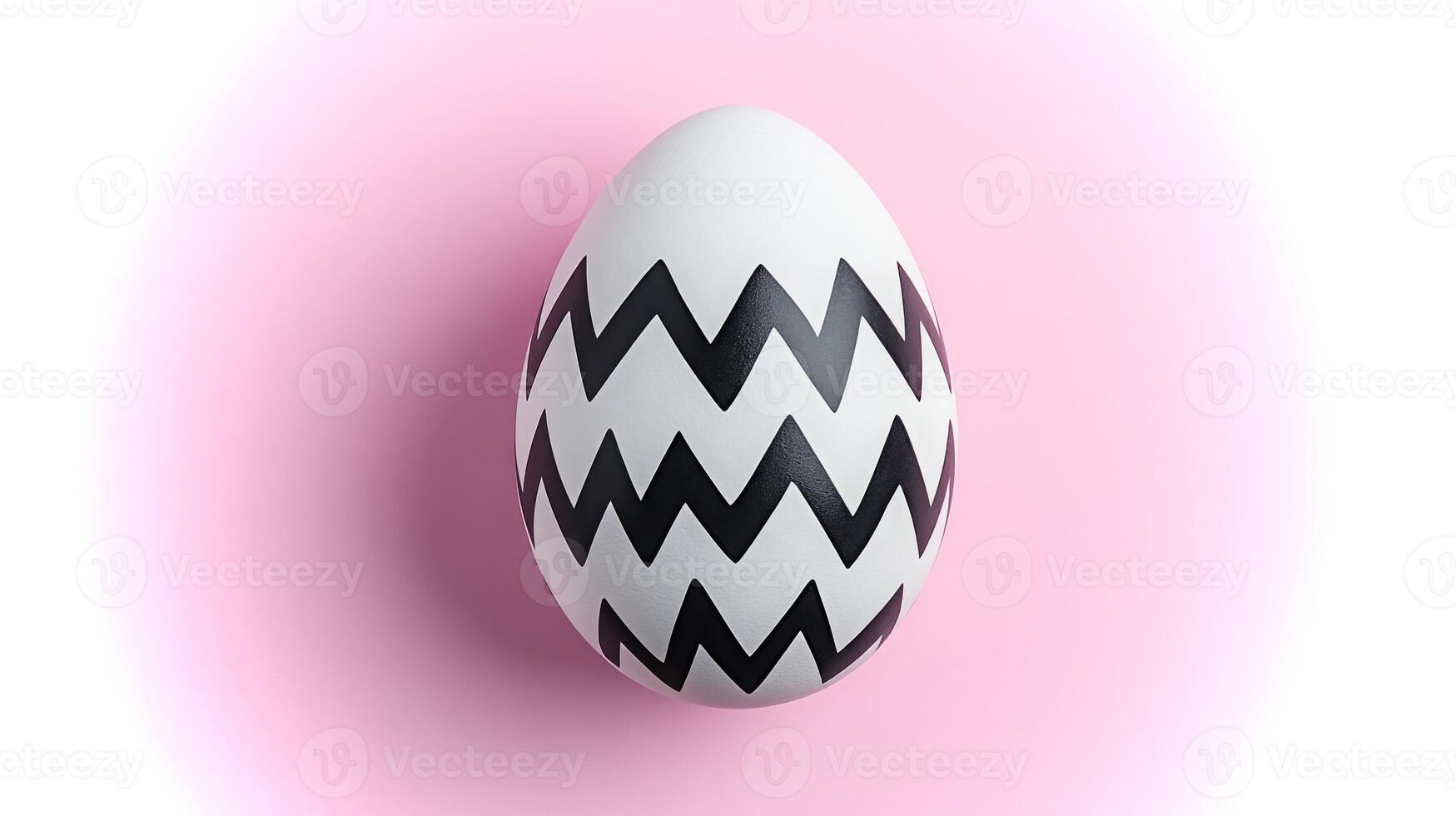 A striking egg with bold black zigzag patterns sits beautifully against a soft pink background, showcasing a blend of simplicity and modern design. photo
