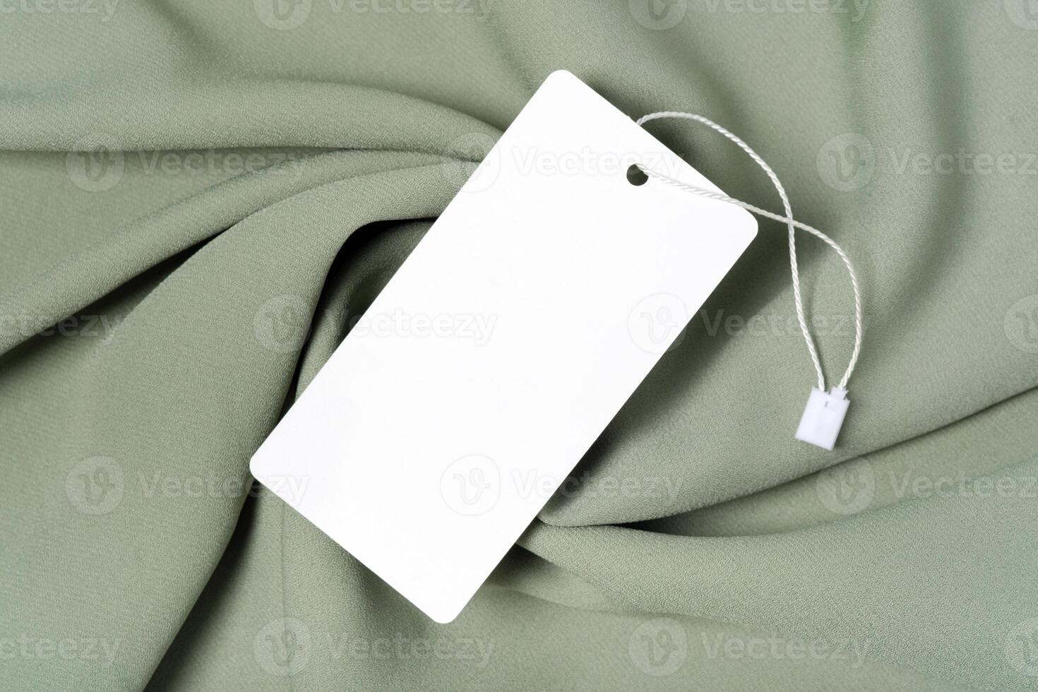 White clothing tag label blank mockup template with the ribbon, to place your design photo