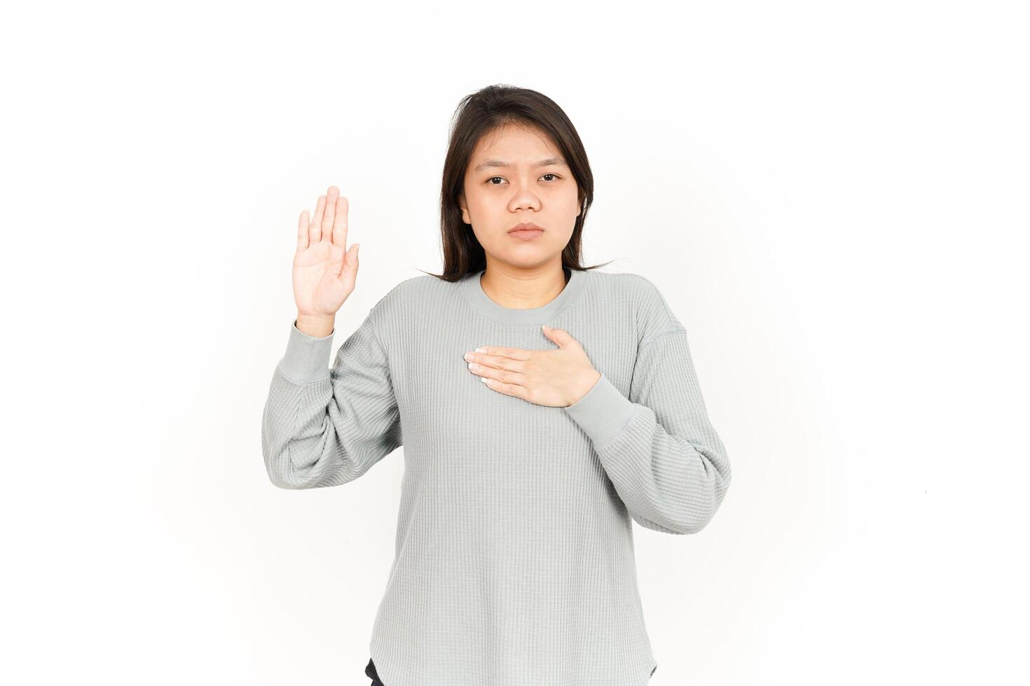 A woman making a gesture with her hands photo