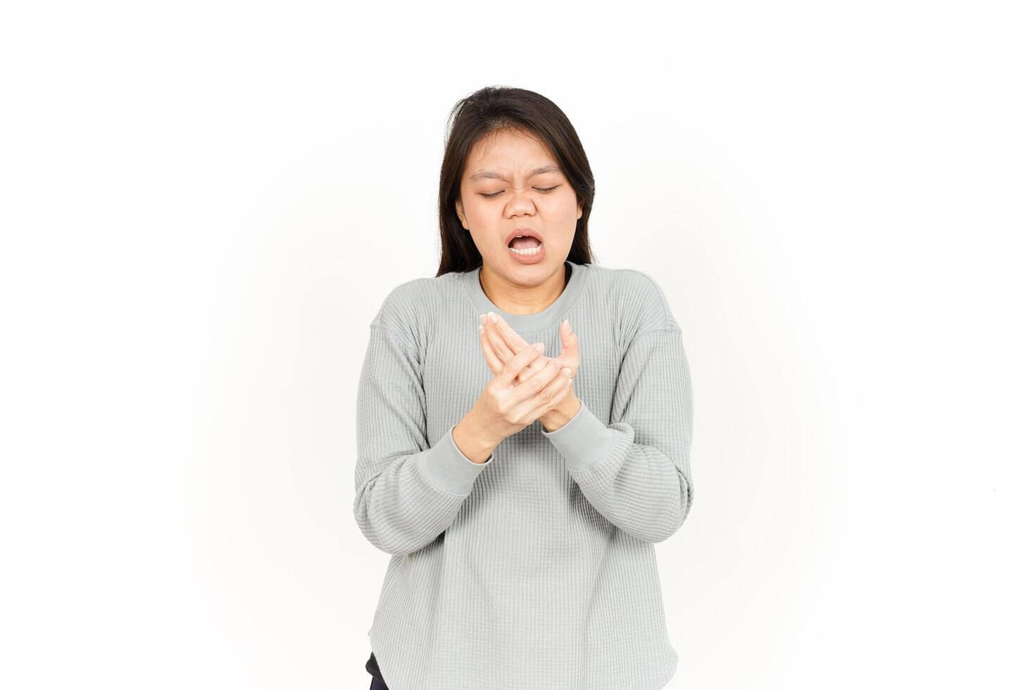 A woman is holding her hands to her mouth photo