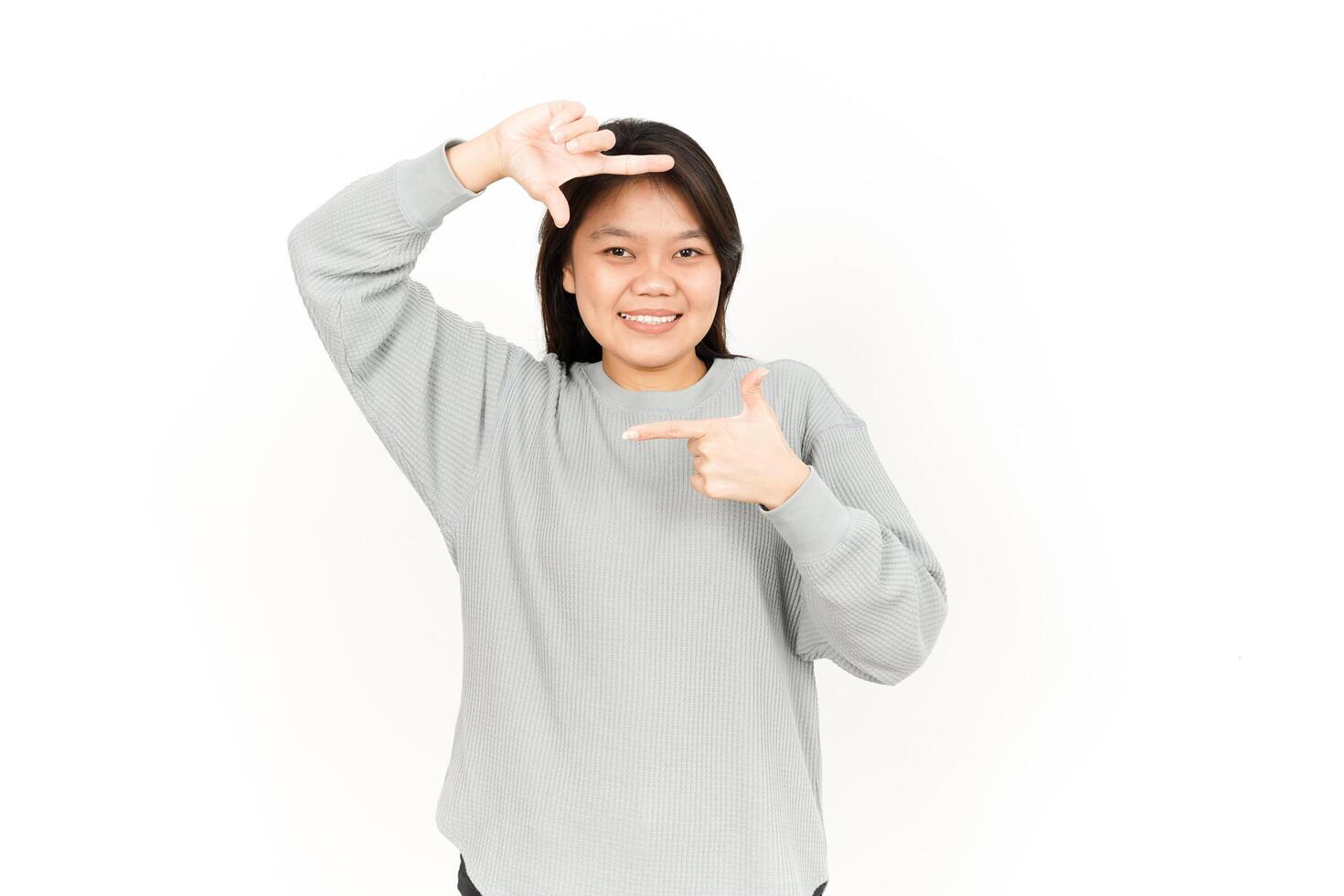 A woman making a gesture with her hands photo