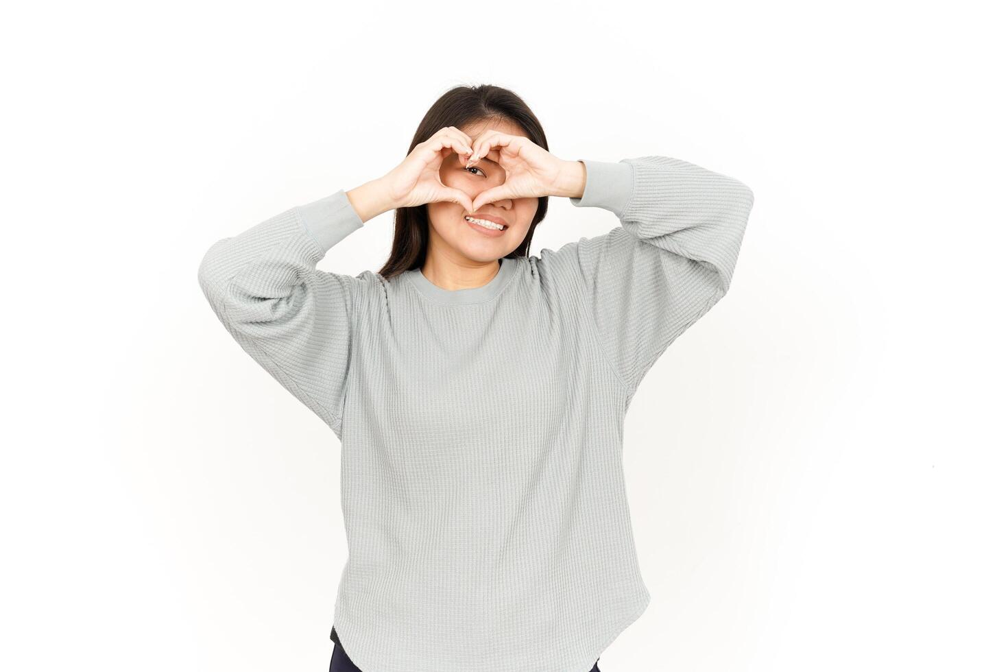 A woman making a heart with her hands photo