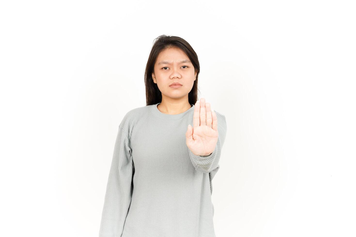 A woman making a stop sign with her hand photo