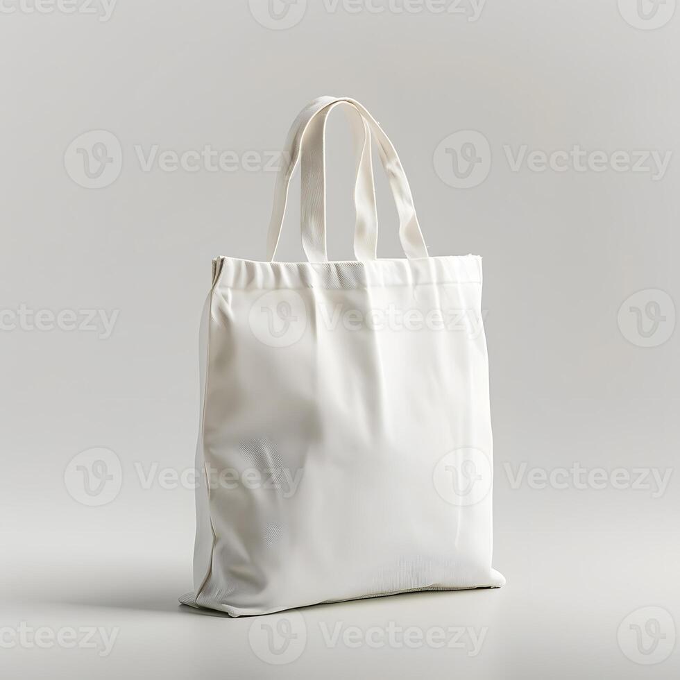 White canvas tote bag on table, with silver facial tissue holder photo