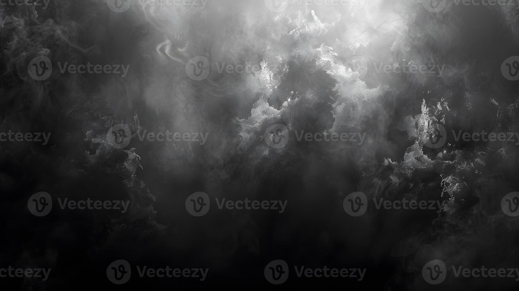 Monochrome photo of a cloudy sky with sun rays peeking through cumulus clouds