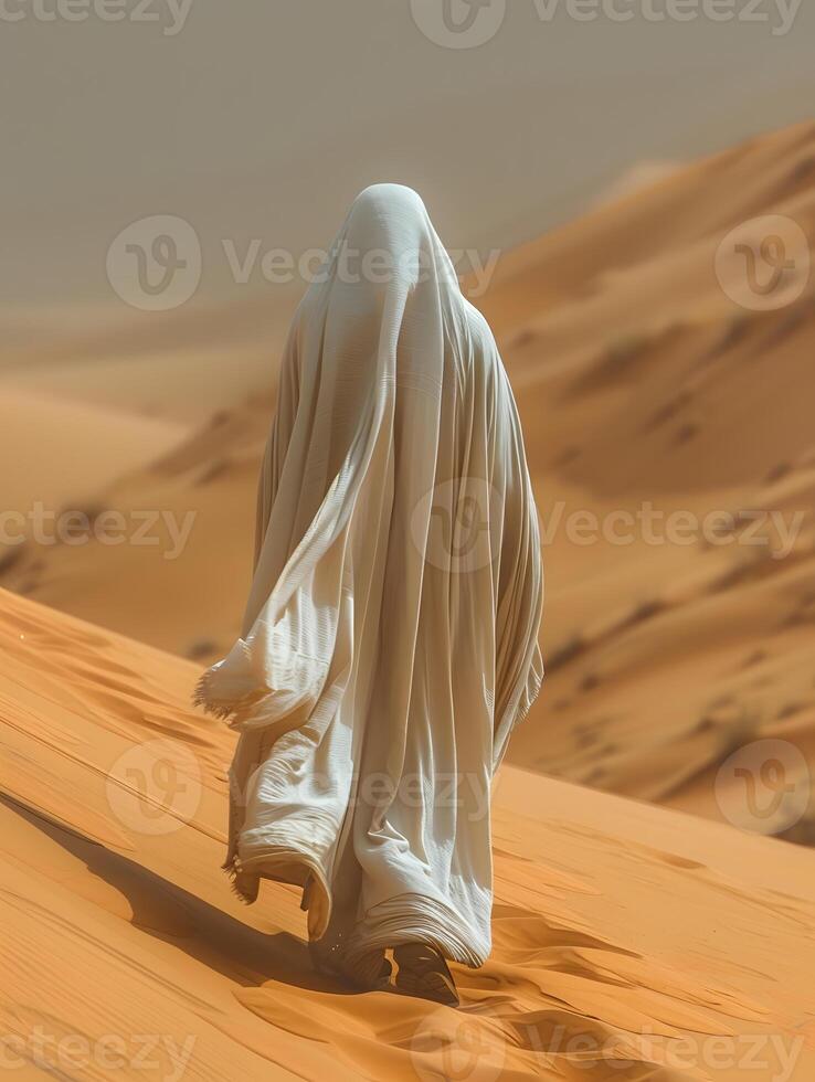 A person in a white veil treks through the sandy Erg landscape photo