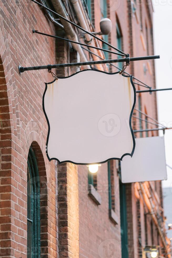 Blank Signage Hang Unused in an Urban setting, Waiting for Ads photo