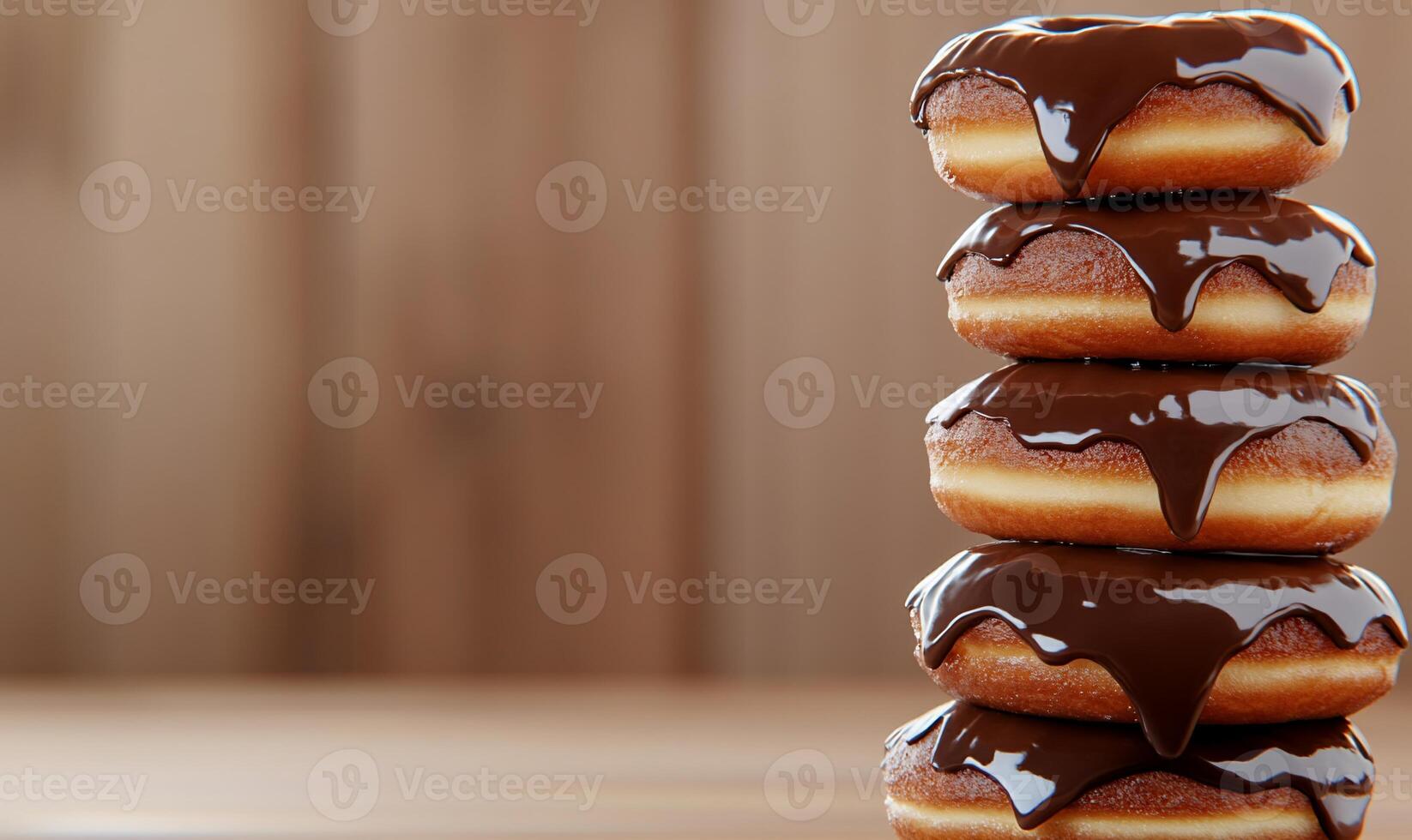 A stack of donuts with chocolate glaze on top photo