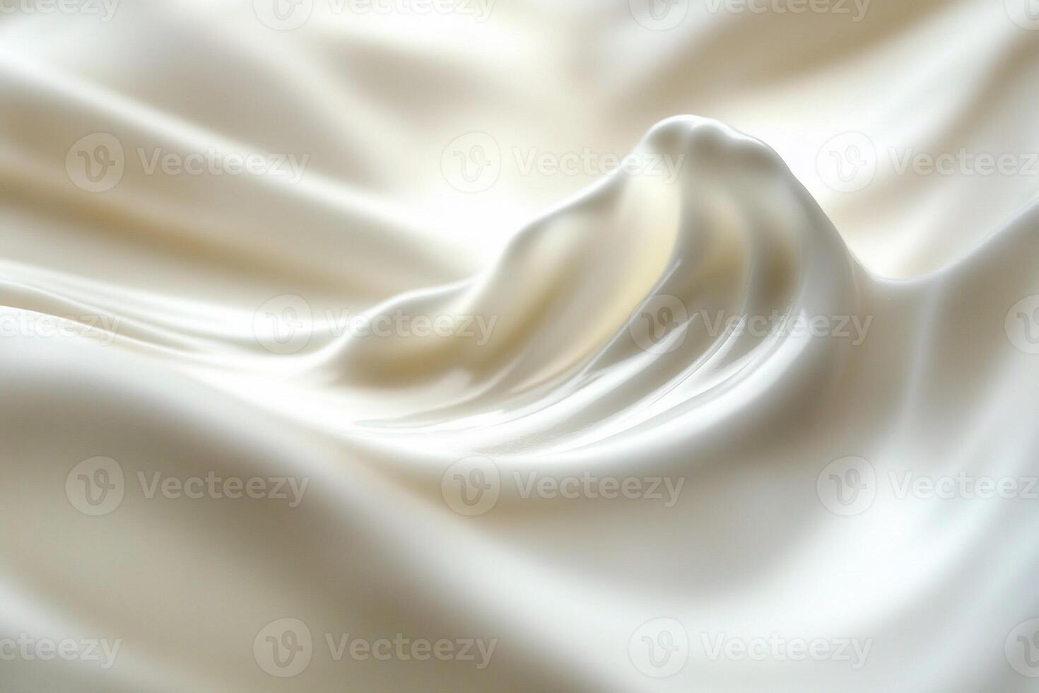 Close-up of creamy, smooth, white substance with flowing texture. photo