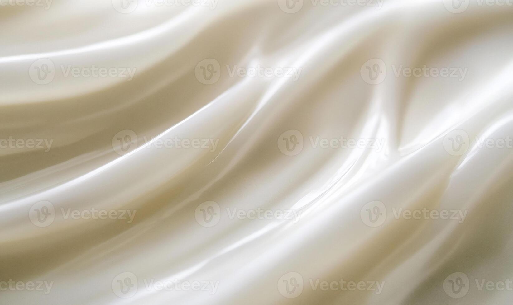 Smooth, flowing cream texture close-up photo