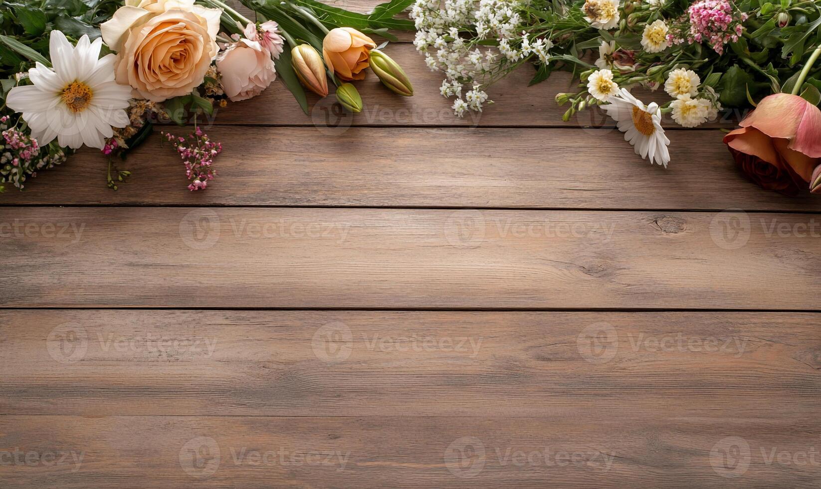 Peach roses, daisies, and wildflowers arranged on rustic wood. photo