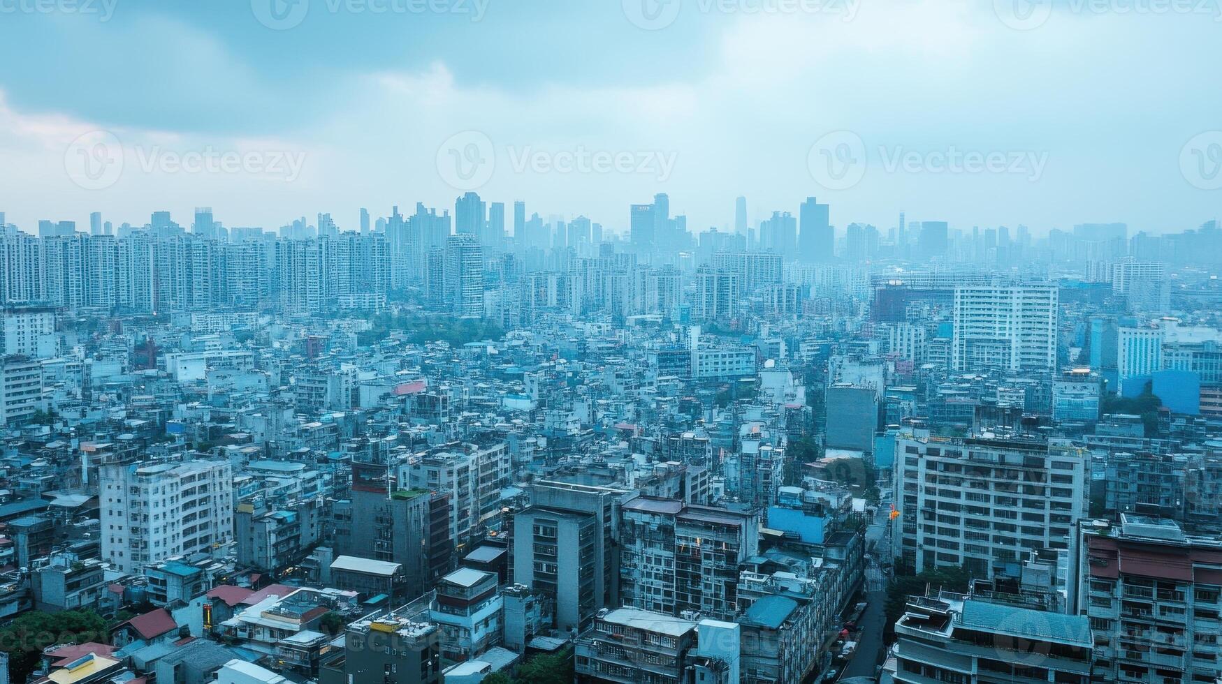 A panoramic view of a densely populated urban landscape under a cloudy sky photo