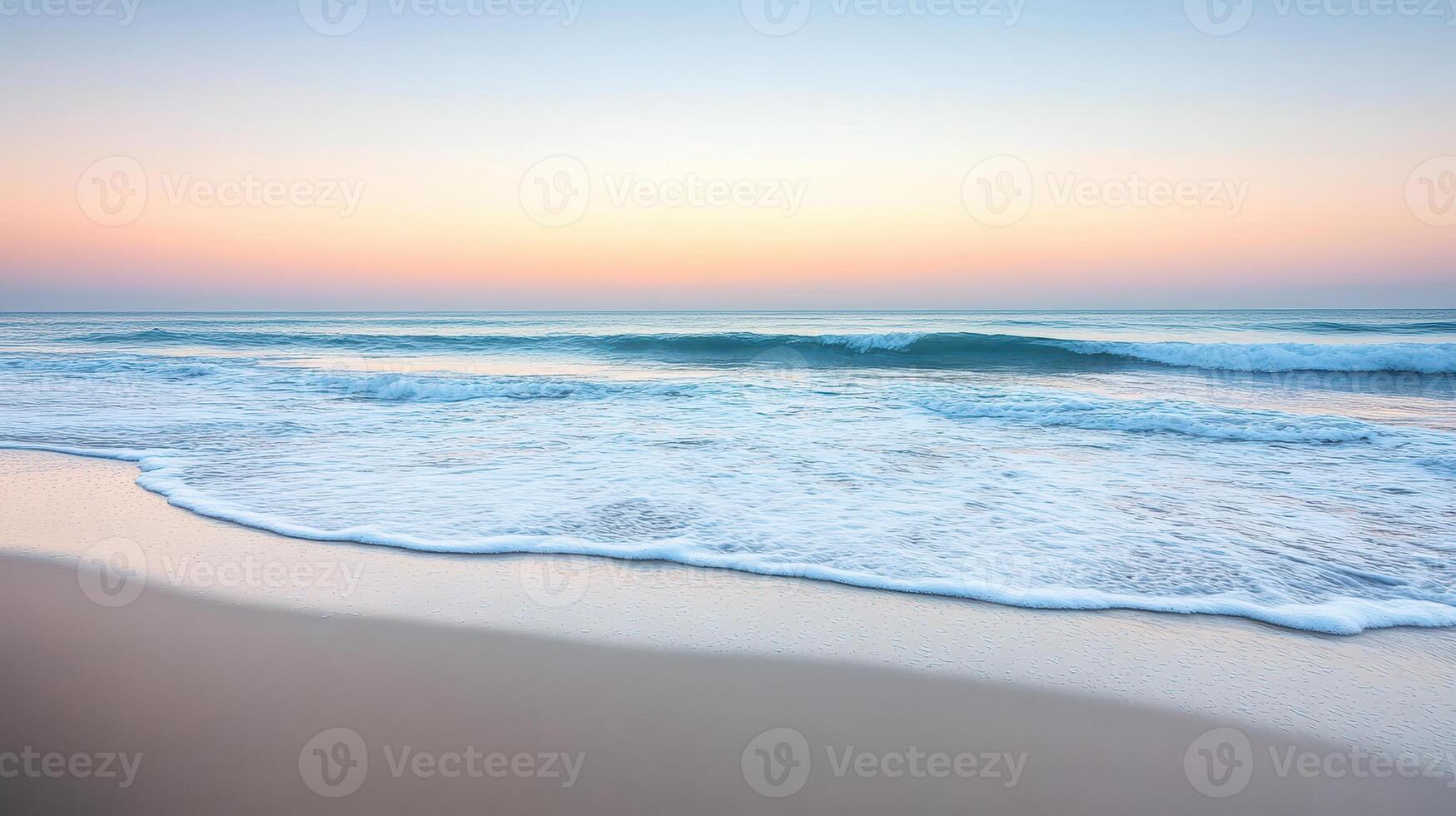 A serene beach scene at dawn with gentle waves and a pastel sky photo