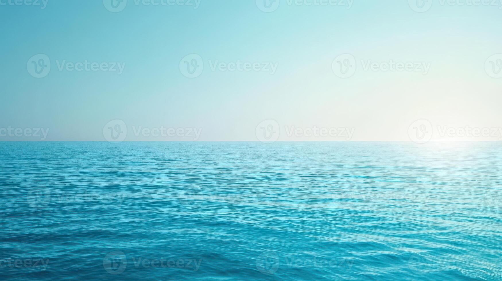 A serene view of calm ocean waters under a clear blue sky photo