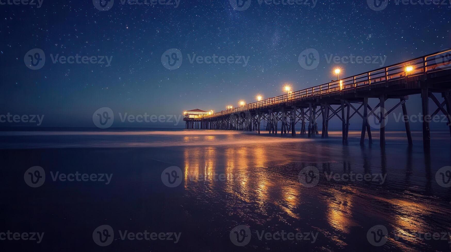 A serene night scene of a pier illuminated by lights under a starry sky. photo