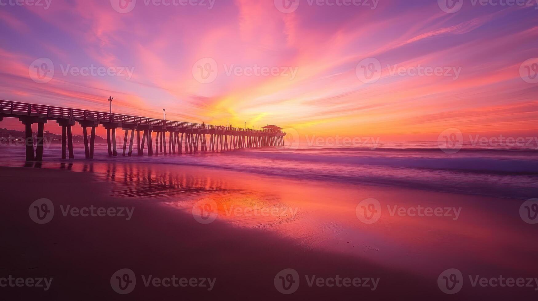 A serene sunset over a pier, reflecting vibrant colors on the water photo