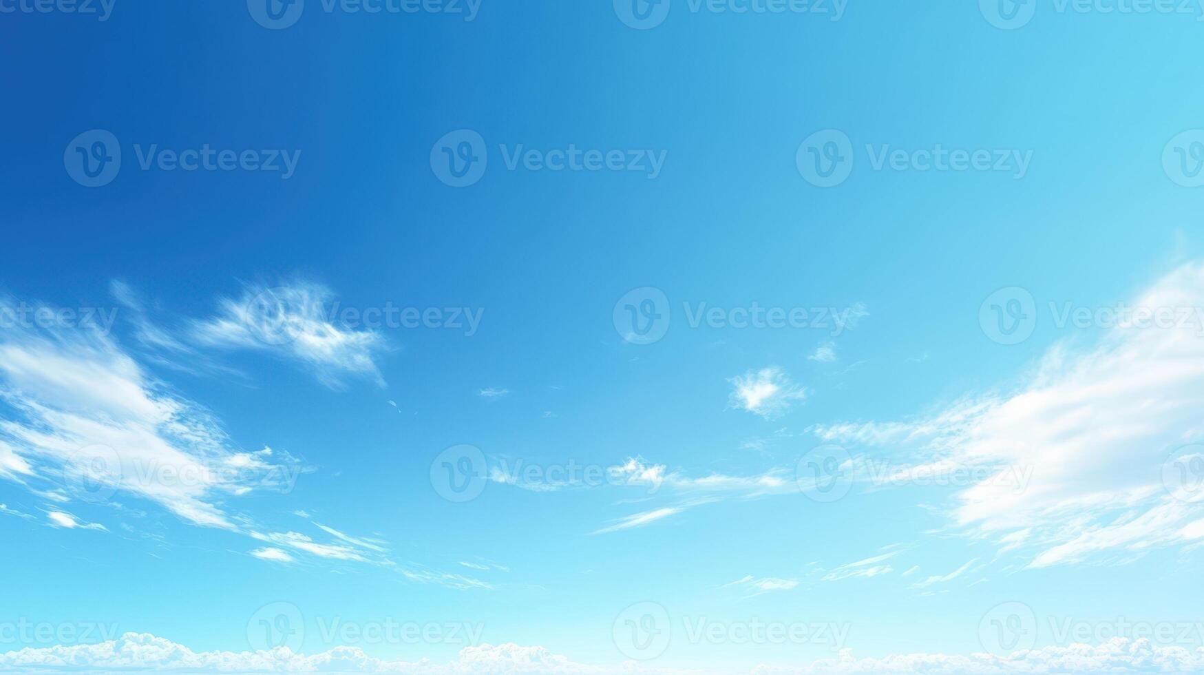 A clear blue sky with scattered clouds, evoking a sense of tranquility and openness photo