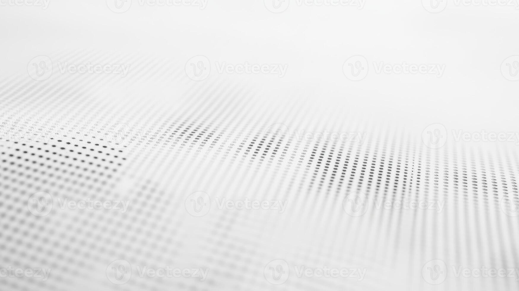 A close-up of a textured surface with a pattern of dots in varying shades of gray. photo