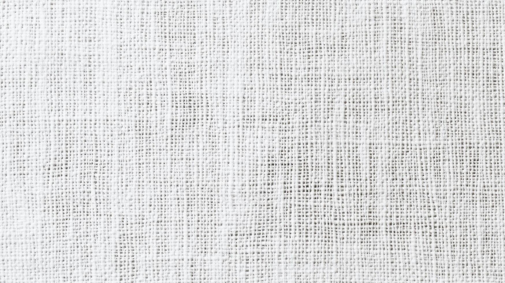 A close-up of a textured white fabric, showcasing its weave and pattern. photo
