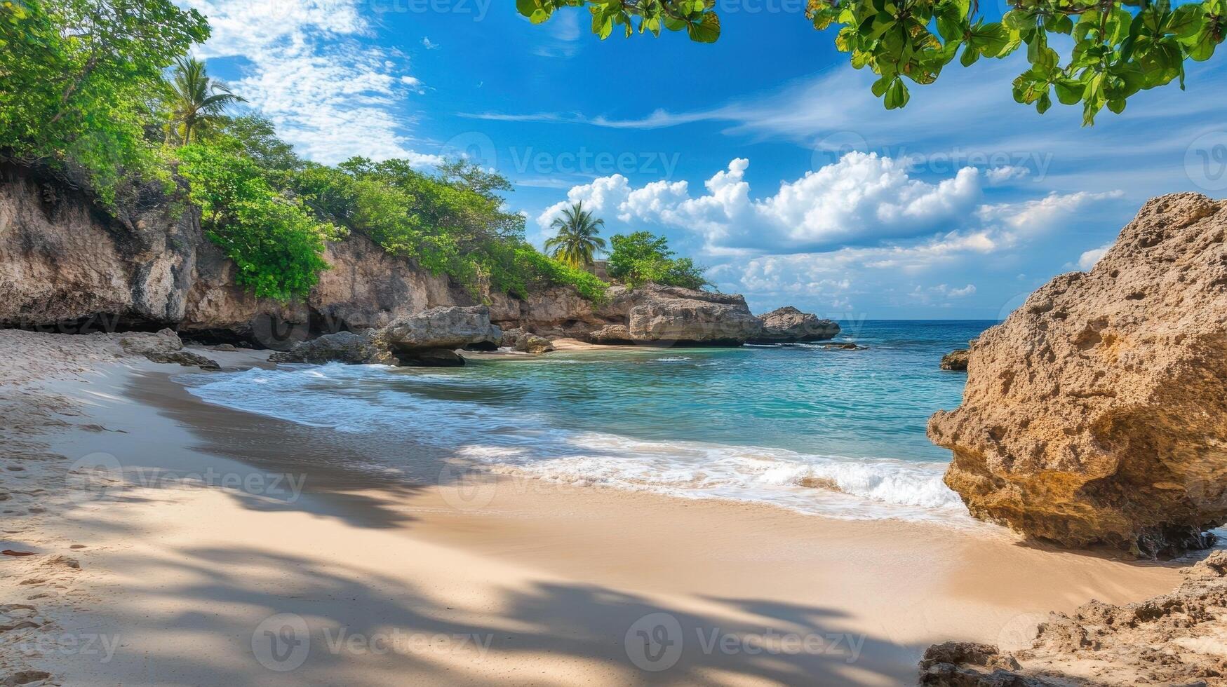 A serene beach scene with clear water, gentle waves, and lush greenery under a blue sky photo