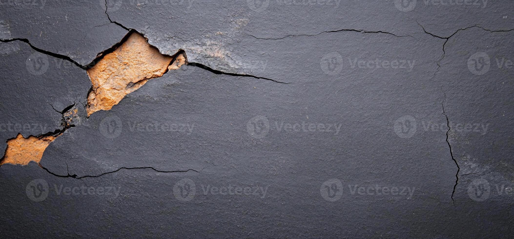 Cracked Dark Stone Surface photo