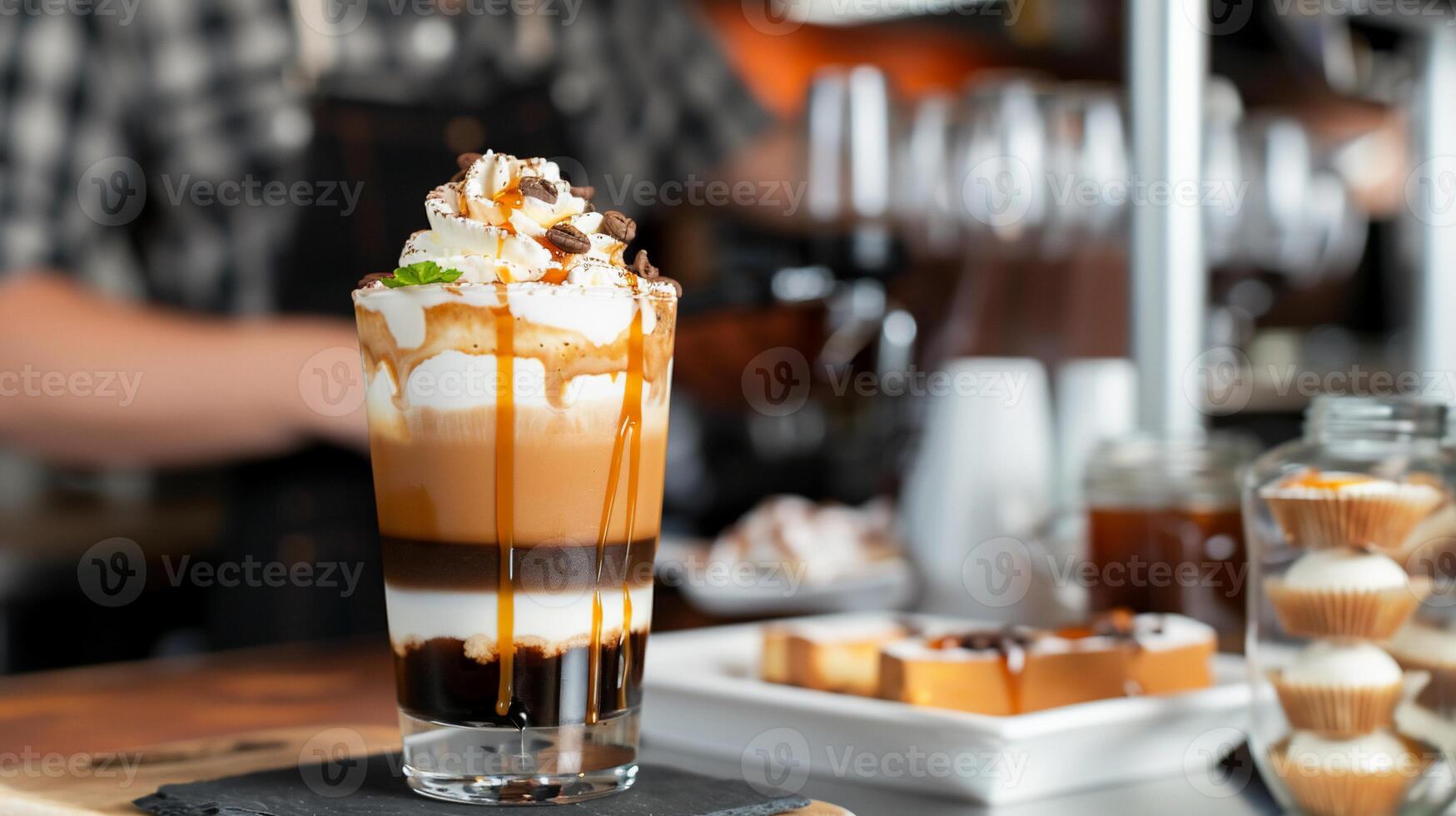 Layered Caramel Coffee Drink in Cafe photo