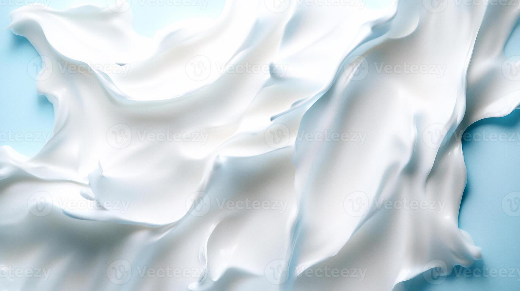 Abstract swirls of white cream on blue. photo