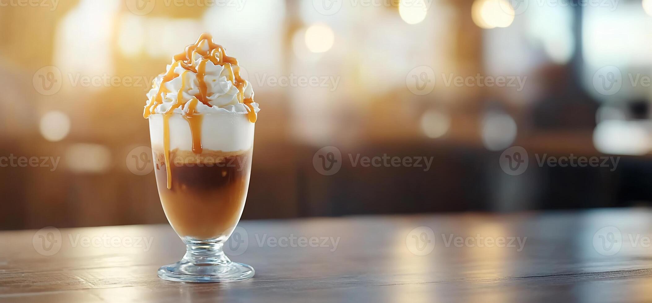 Caramel Coffee Drink on Cafe Table photo