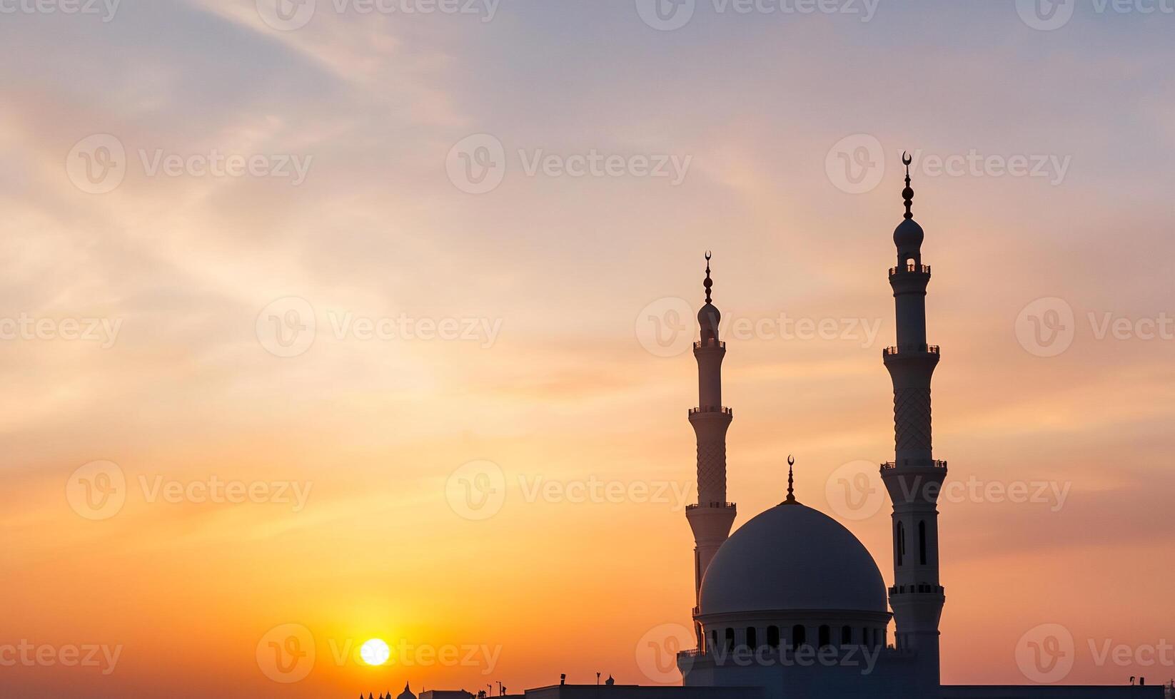Sunset silhouette of a mosque with two minarets. photo