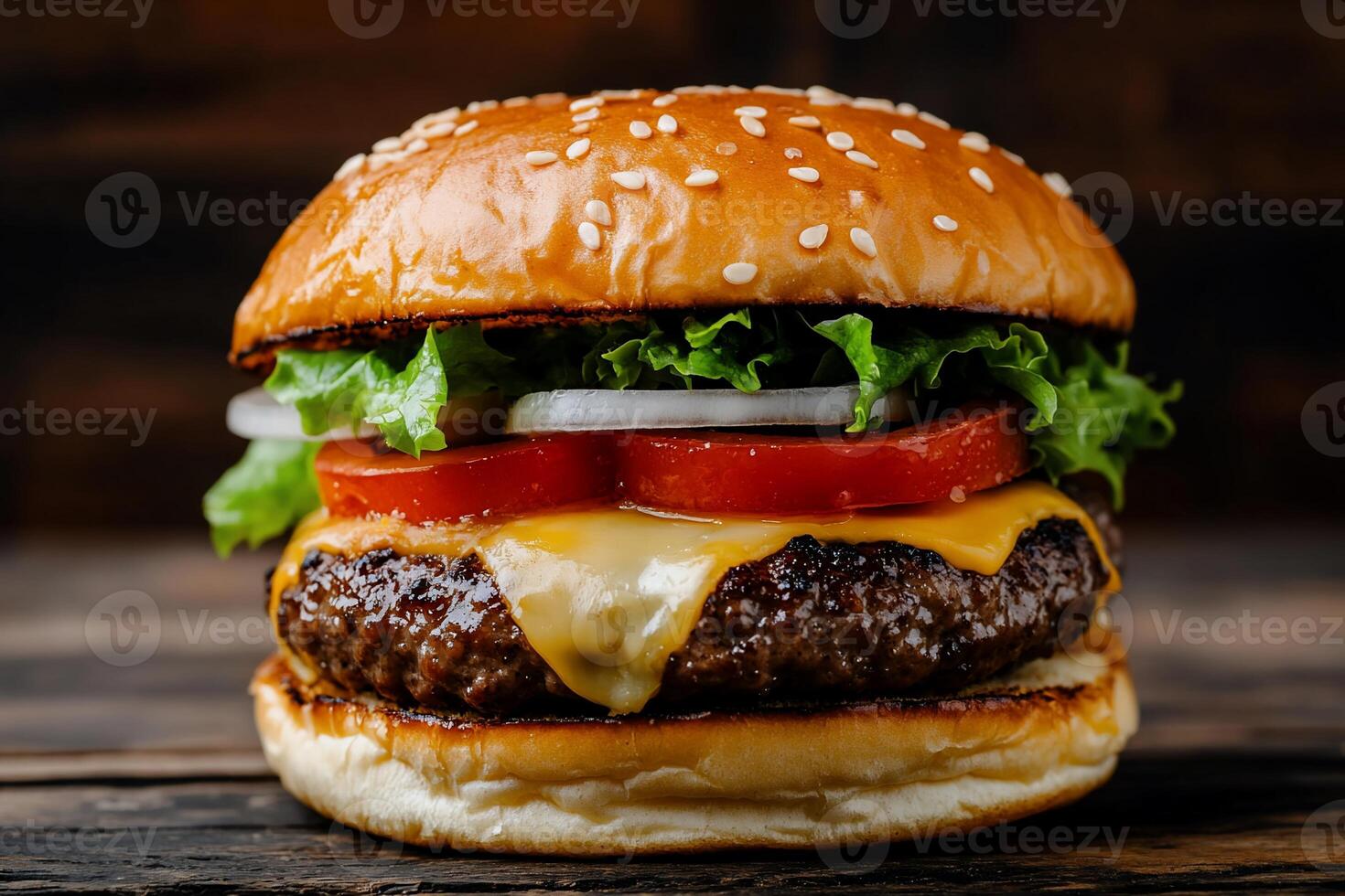Delicious juicy cheeseburger. Freshly made, gourmet burger with melted cheese, lettuce, tomato, and onion on a toasted bun photo