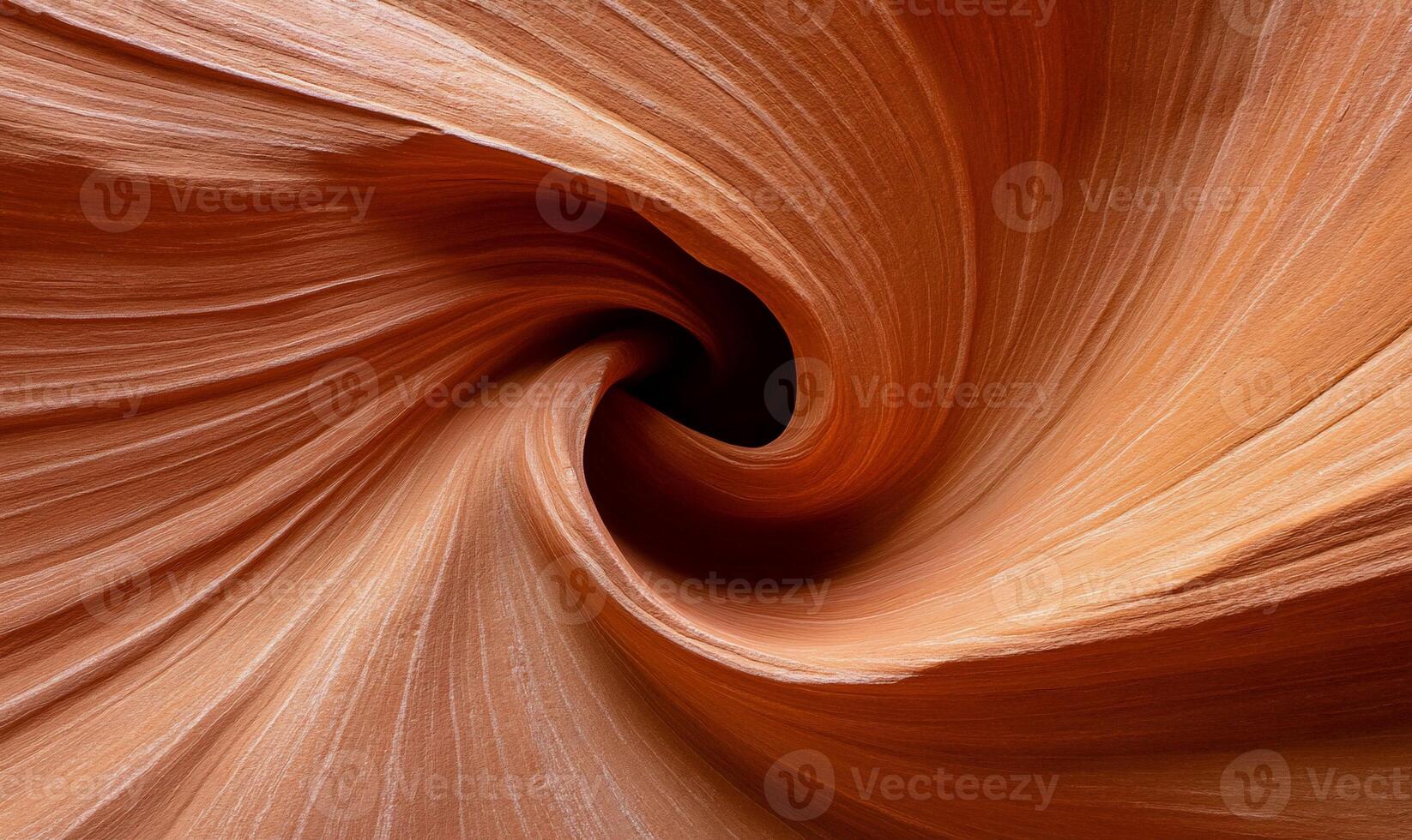 Spiral sandstone canyon. Detailed close-up view of the swirling, layered rock formations photo