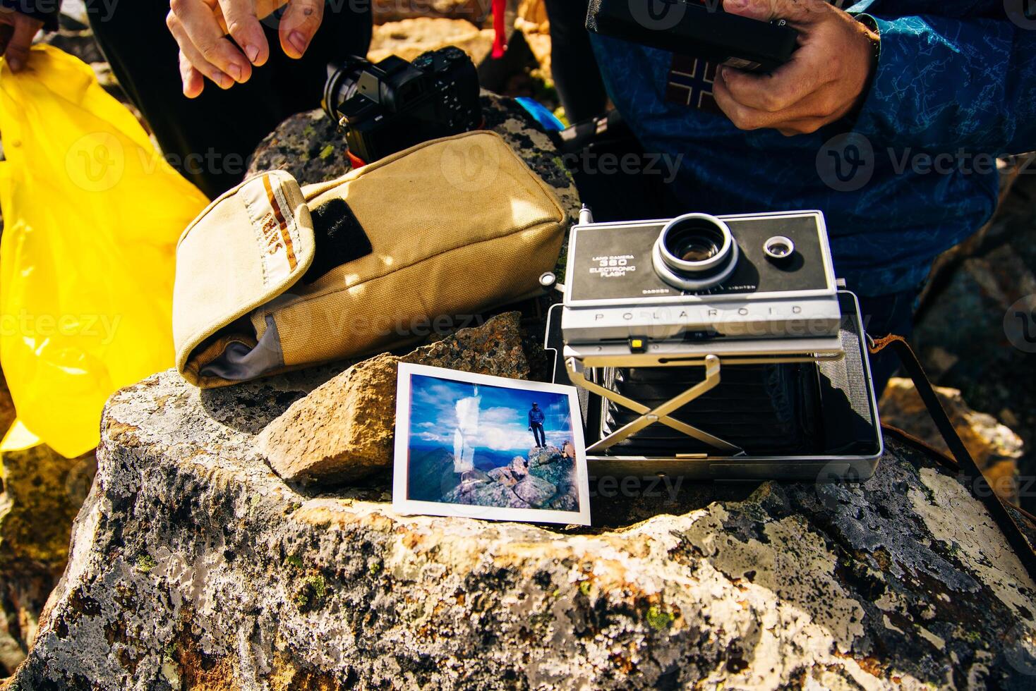 old Polaroid camera and a photograph taken on a mountain trip. nepal - september 12th 2023 photo