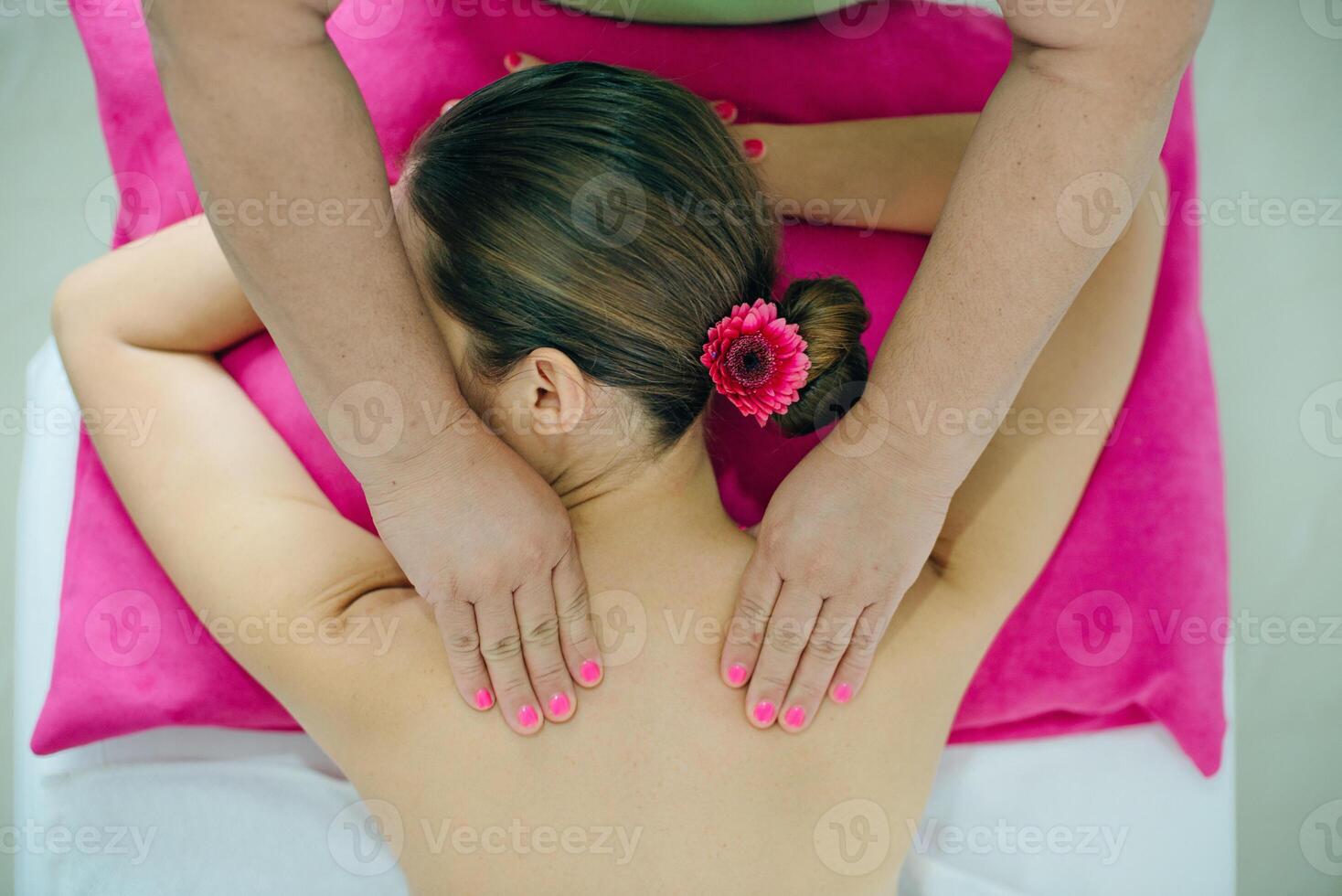 woman masseur doing girl massage in Spa salon close-up, photo