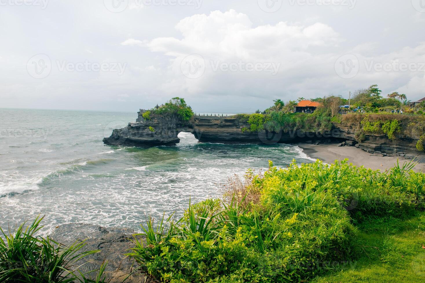 Pura Tanah Lot Temple and rock formation in Bali island in Indonesia - may 2 2024. photo