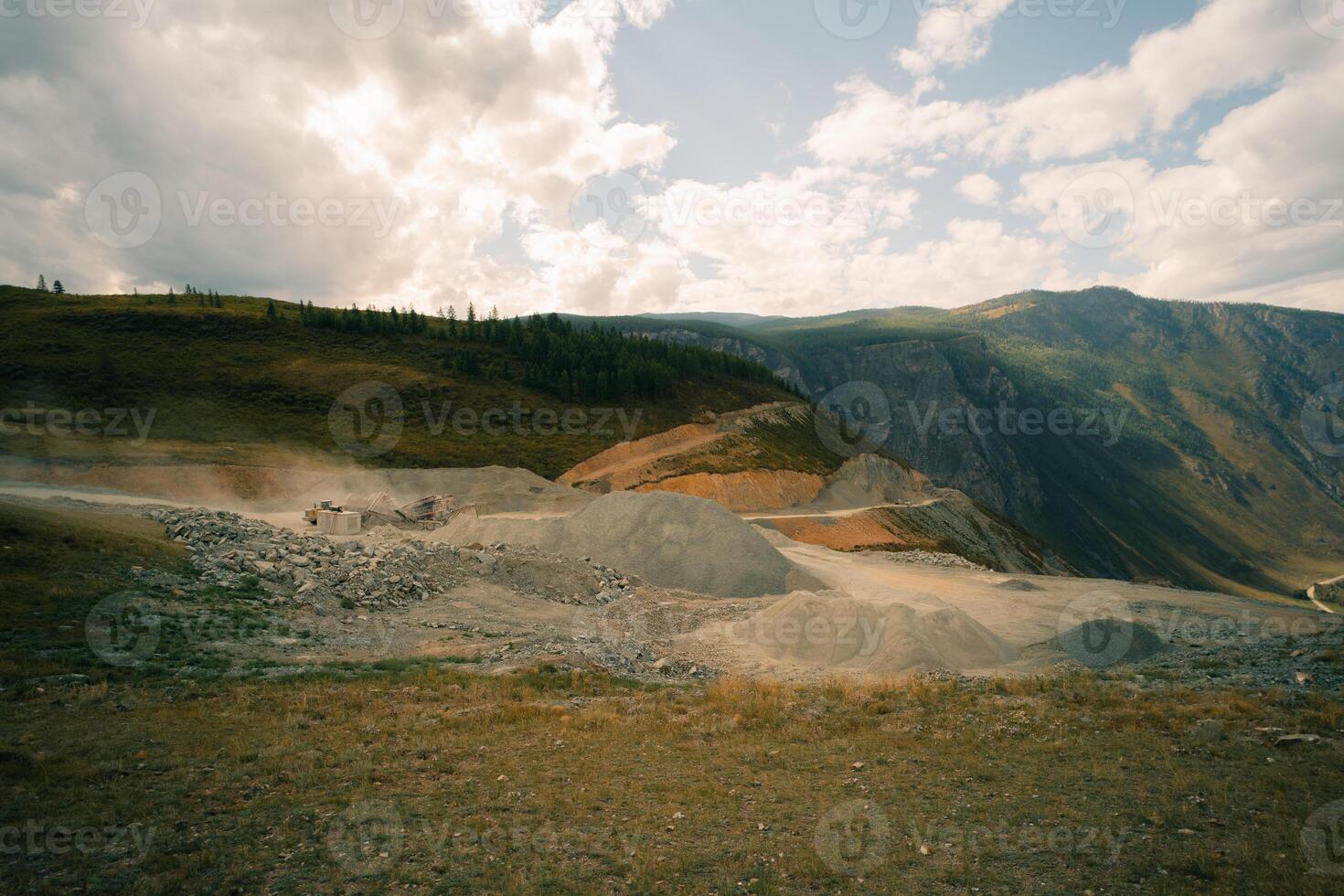 Rock stone crushing machine against a blue sky, close-up. Mining industry. Quarry and mining equipment. photo