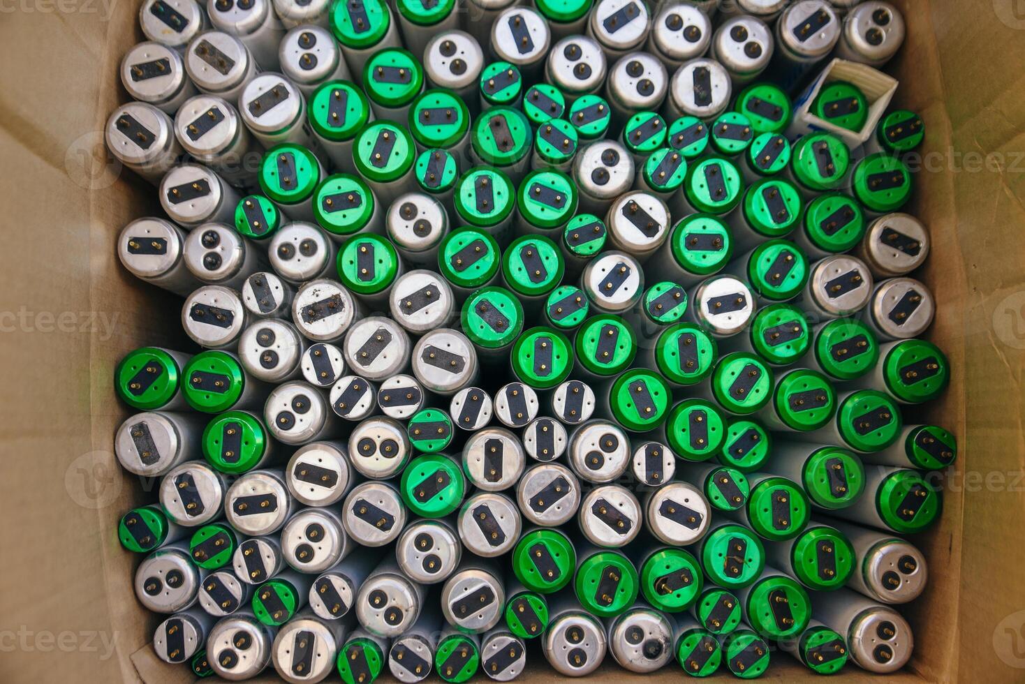 Old fluorescent lamps are stacked in rows. Background view. photo