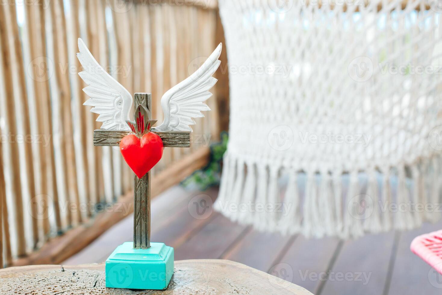 stand cross with a heart. home decoration. photo