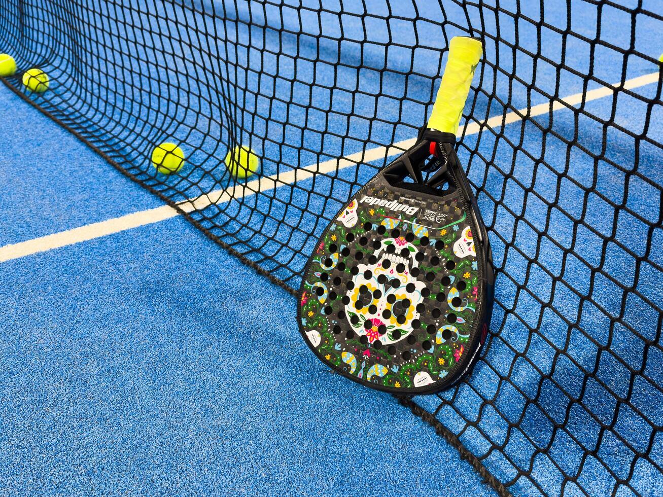 February 24, 2025 Kyiv, Ukraine padel racket on a padel court with a ball photo