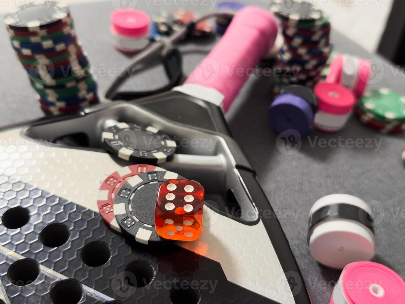 padel racket and poker table, chips photo