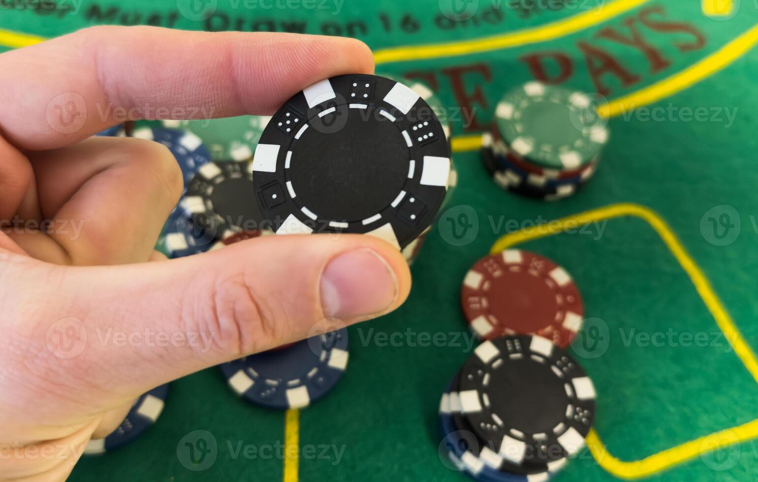 Poker Chips on a gaming table with dramatic lighting photo