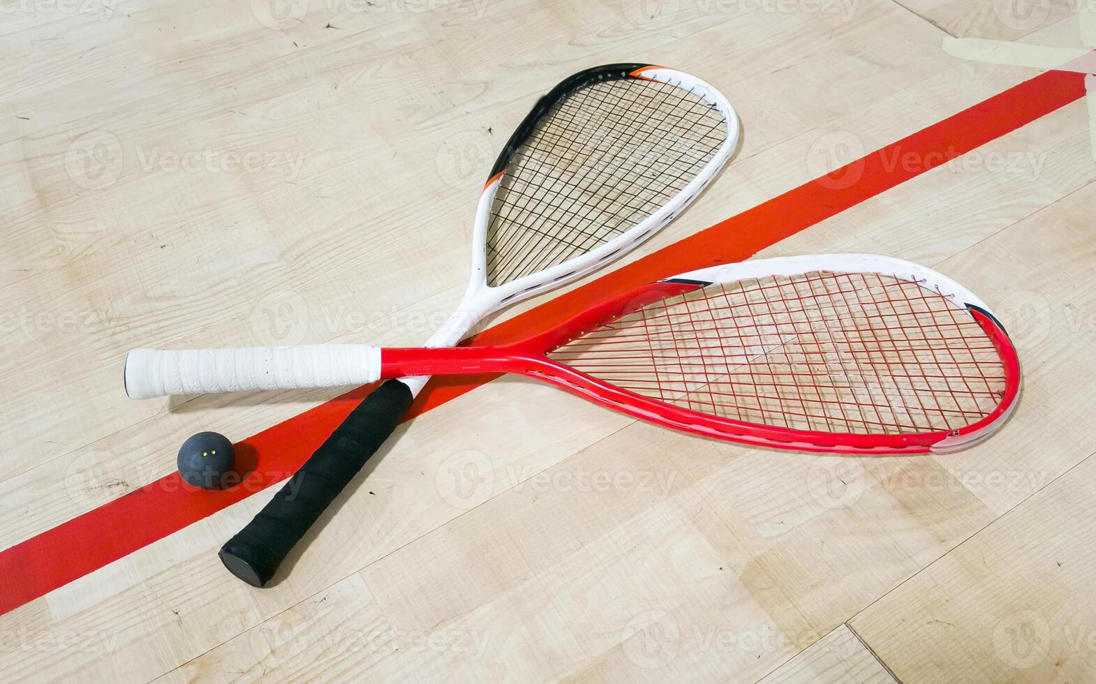 Sports, above and racket on squash court for competition, challenge and training center. Exercise, interior and empty room with top view of wooden floor of gymnasium for games, fitness club and gear photo