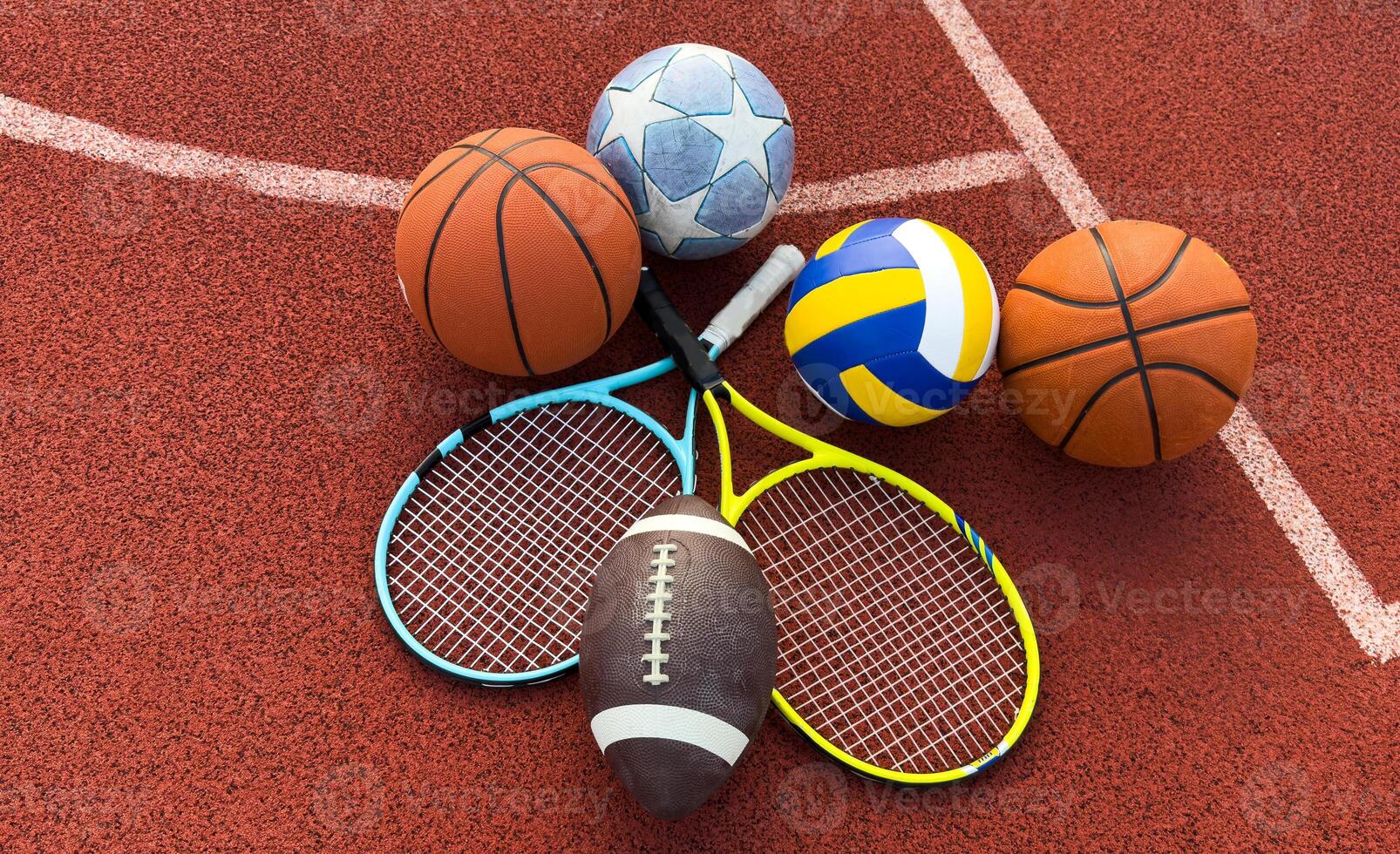 Stack of different sport balls on background photo