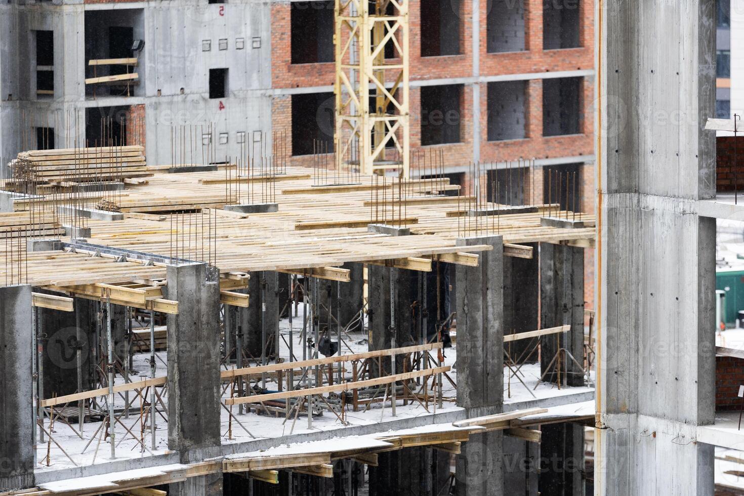 Construction site background. Hoisting cranes and new multi-storey buildings. Industrial background. photo
