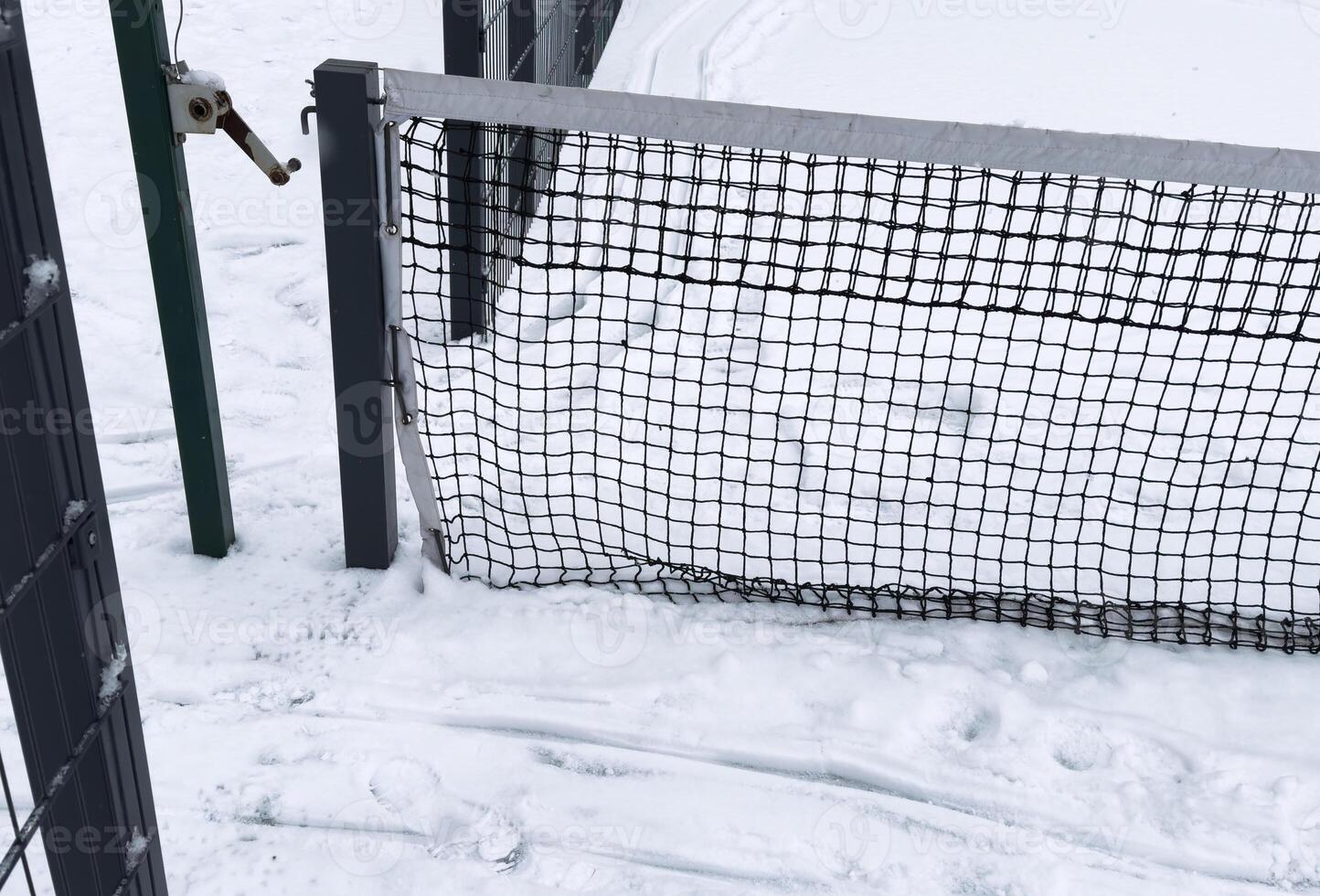 winter padel tennis court full of snow photo