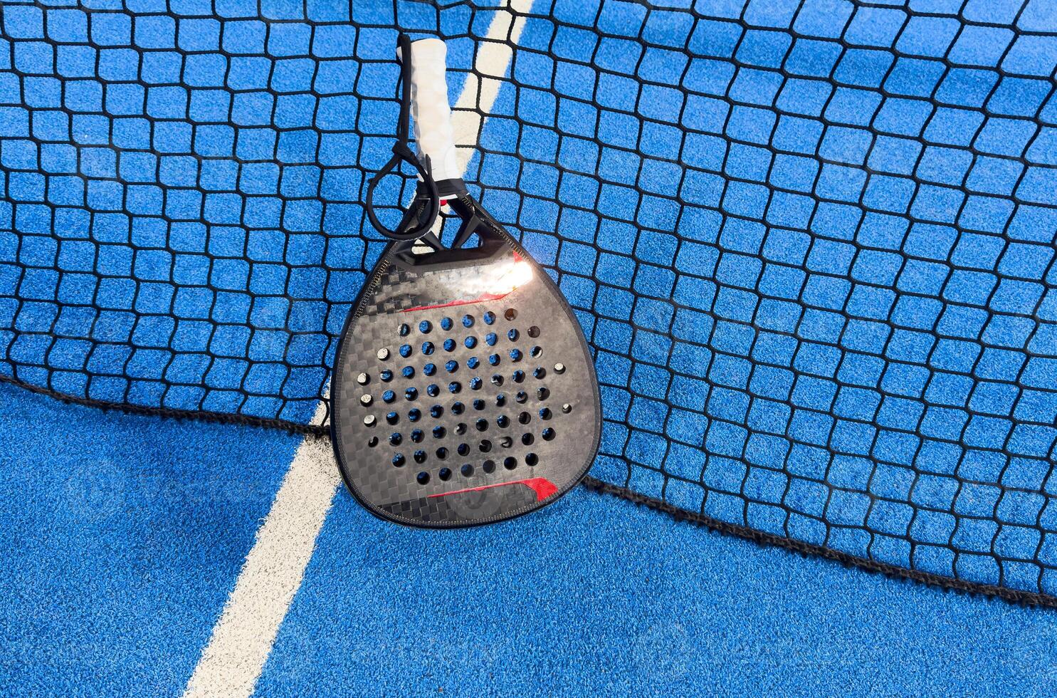 The tennis ball on the padel court photo