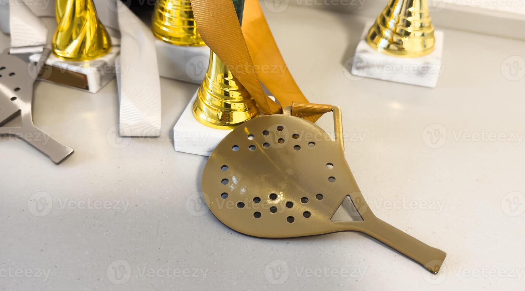 Golden trophy and padel racket. sport achievement, success concept. Business successful. photo