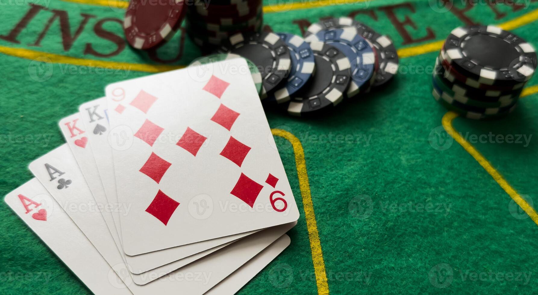 A popular and exciting poker game with a winning combination. Playing cards and chips on a table in a poker club. Advertising space. photo