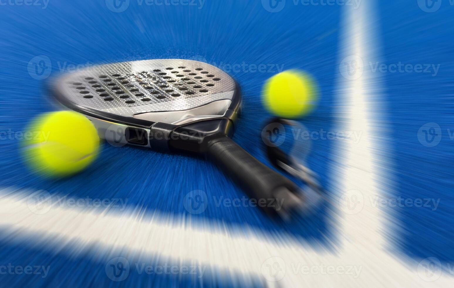padel racket on a padel blue court with a ball photo