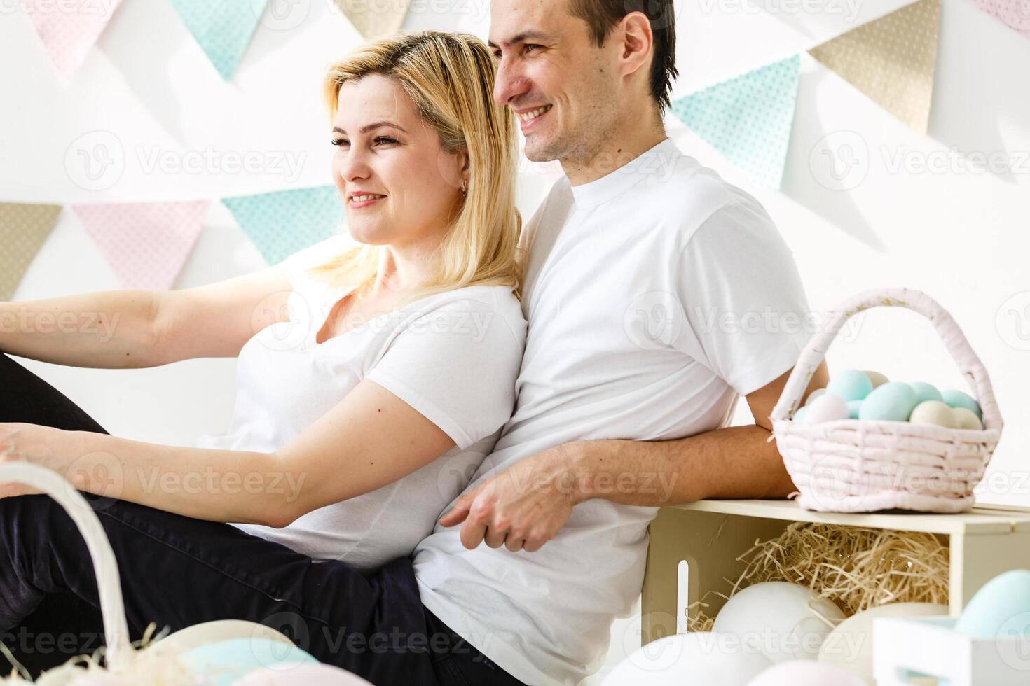 happy family with easter eggs. Happy family preparing for Easter. photo